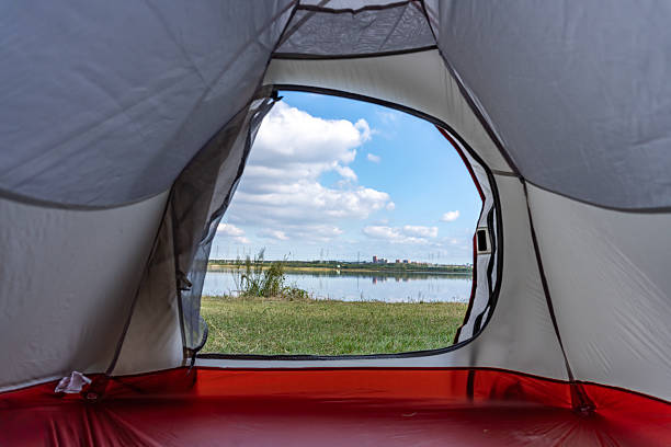 istock View from inside a tent showing a scenic lake and open sky 2243993705