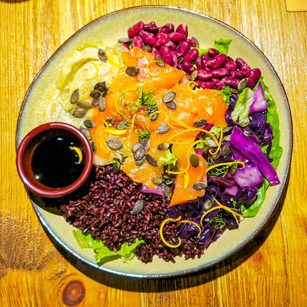 Healthy salmon rice bowl with vegetables