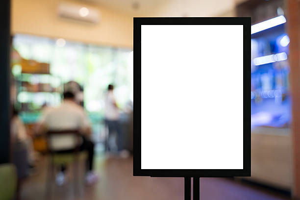 istock Blank white advertising signboard in cafe interior with blurred background for restaurant marketing concept 2243996602