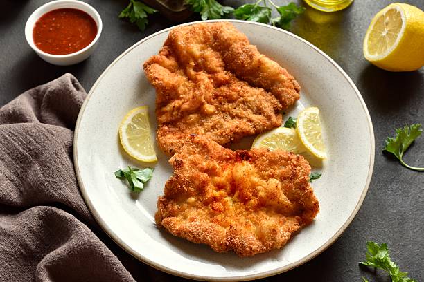 istock Schnitzel with served with lemon and parsley 2243996642