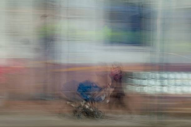 istock Woman pushing pram ICM. 2243996648