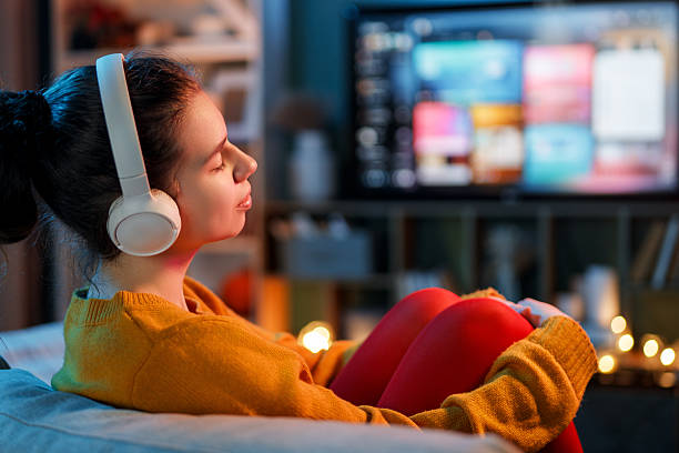 istock woman watching TV at home 2243996766