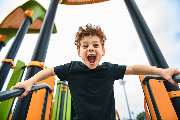 A Happy kid on playground on summer season