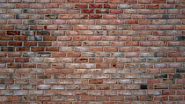 istock Old brick wall texture for background or wallpaper. Vintage masonry surface with bricks. Stone wall for design and construction themes. Rustic brickwork, wall backdrops. Old masonry wall. 2243998623