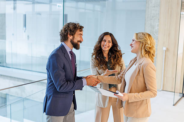 istock Businesspeople shaking hands making an agreement in office 2243999172