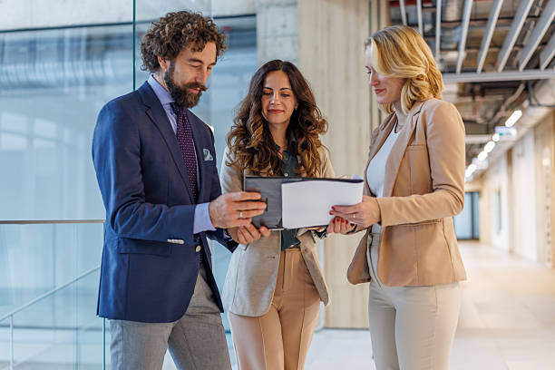 istock Business colleagues discussing project with digital tablet and documents 2243999175