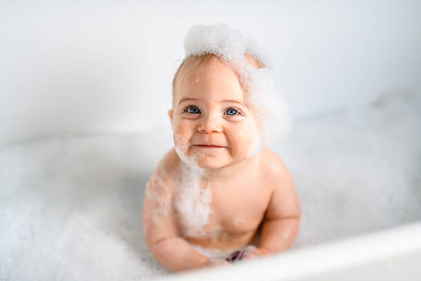 istock Cute little child bathing in tub at home 2244000137