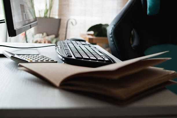 istock Home office desk preparing taxes and finances 2244001088