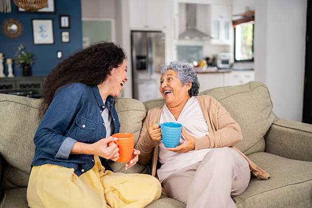 istock Mother and daughter talking during afternoon coffee at home 2244004238