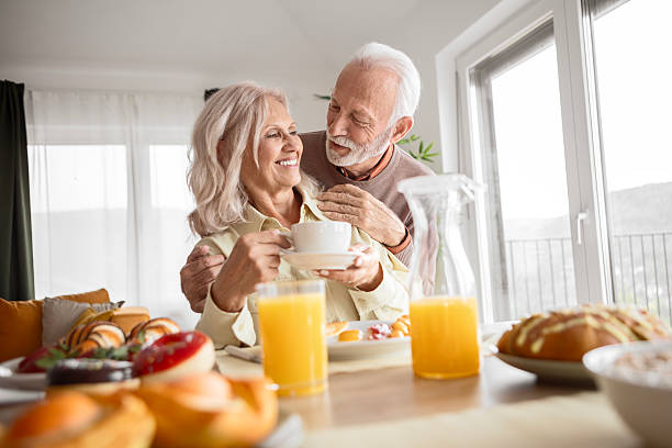 istock Smiling Senior Couple Having Breakfast and Coffee at Home 2244006235