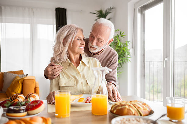 istock Elderly Partners Drinking Coffee and Chatting Over Breakfast 2244006318