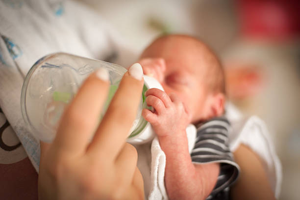 istock Caring for a newborn during feeding time in a cozy environment at home 2244006406