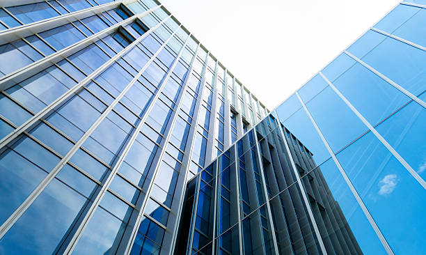 istock Low angle view of blue glass skyscraper facade 2244008074