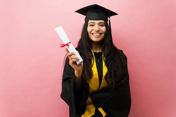 istock Happy student graduating holding diploma celebrating success 2244008830