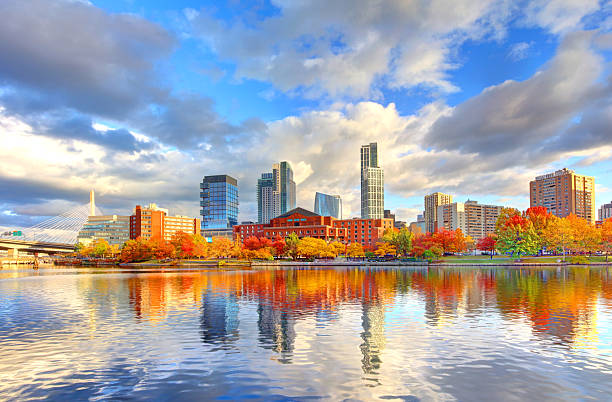 Autumn foliage along the Charles River and the skyline of Boston's West End.