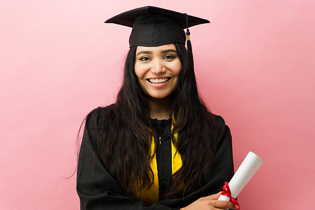 istock Female graduate student celebrating success with diploma 2244010257