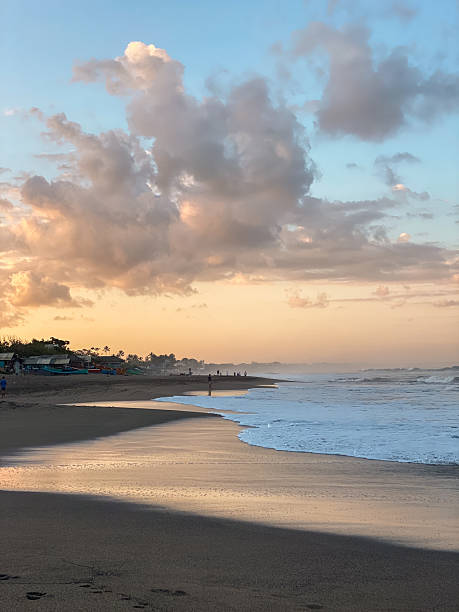 istock Beautiful sunrise with pink clouds on beach 2244016424