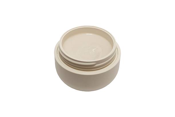 istock Beige jar with natural cosmetic cream isolated on white background 2244020026
