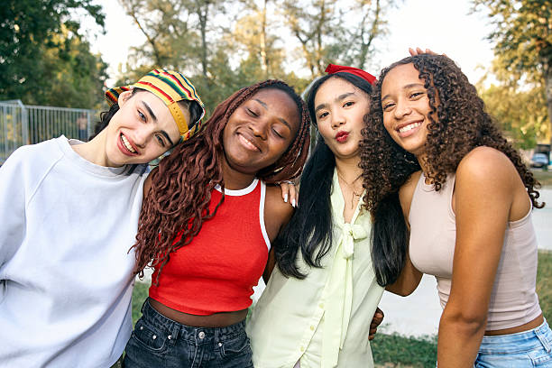 istock Diverse Group of Happy Friends Smiling Outdoors in a Park Setting 2244027461