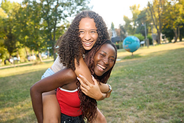 istock Two Young Women Enjoying a Fun Day Outdoors on a Sunny Day 2244027493