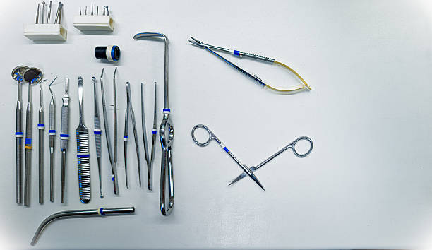 istock Dental surgical instruments on white background with copy space 2244027639
