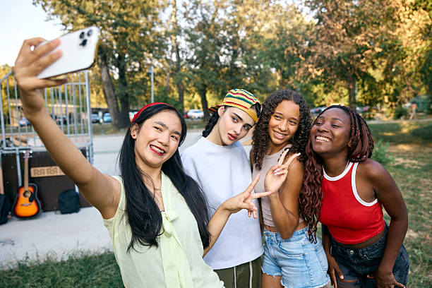 istock Group of Friends Taking a Fun Selfie Outdoors in a Park 2244027987
