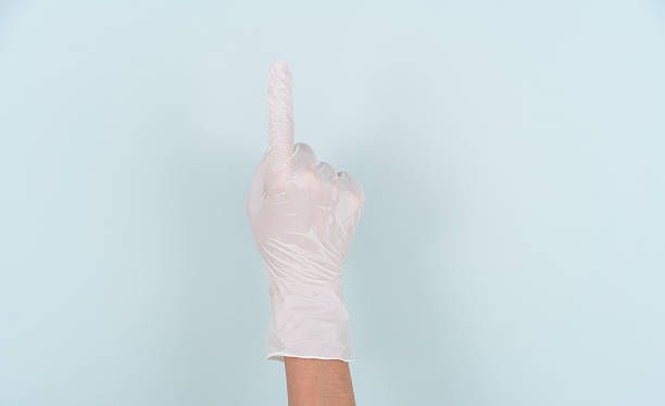 istock Making the number 1 gesture with a hand wearing a disposable glove 2244033773