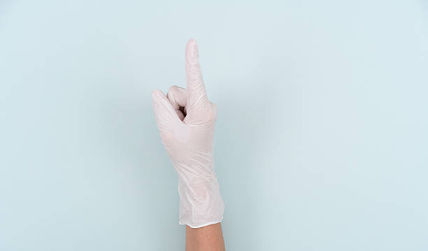 istock Making the number 1 gesture with a hand wearing a disposable glove 2244033853