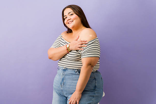 istock Plus size woman feeling safe after vaccination in a studio 2244035624