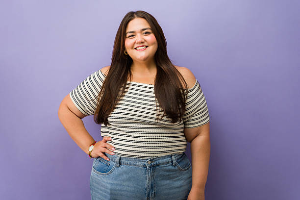 istock Happy plus size woman posing looking at camera 2244037038