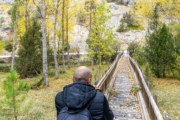A man walks through a natural setting -  autumn landscapeCalatañazor - Soria - Spain