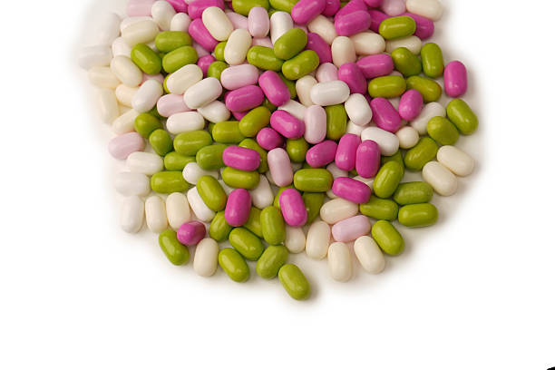 istock Sweet multicolored candies isolated on white background. 2244040054