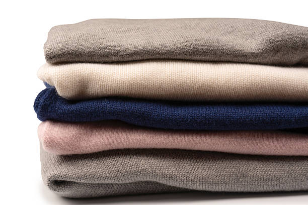 istock A group of warm sweaters isolated on a white background. 2244040078