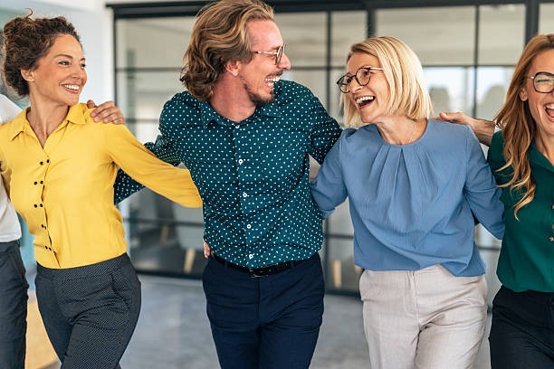 istock Business team embracing after achieving goals 2244041466