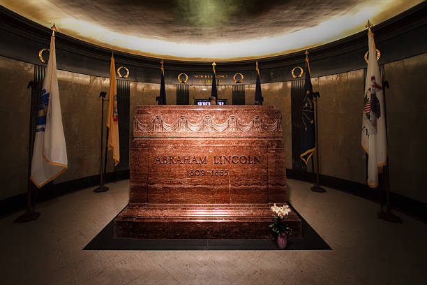 Status of Abraham Lincoln outside the Nebraska Capitol Building in Lincoln against a blue sky