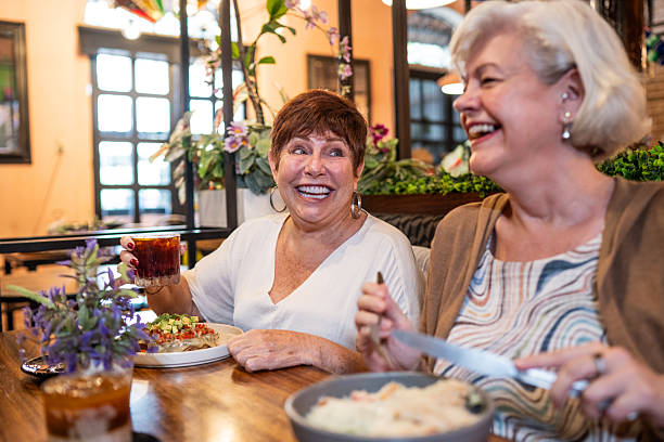 istock Senior friends women talking during lunch on restaurant 2244048837