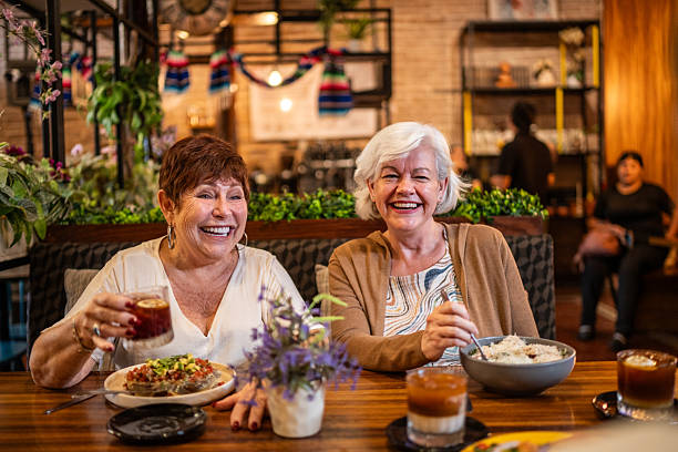 istock Senior friends women talking during lunch on restaurant 2244048874