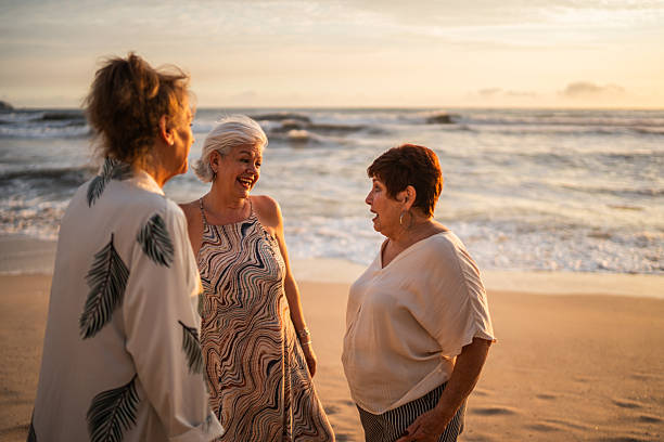 istock Senior friends women talking on the beach 2244050001