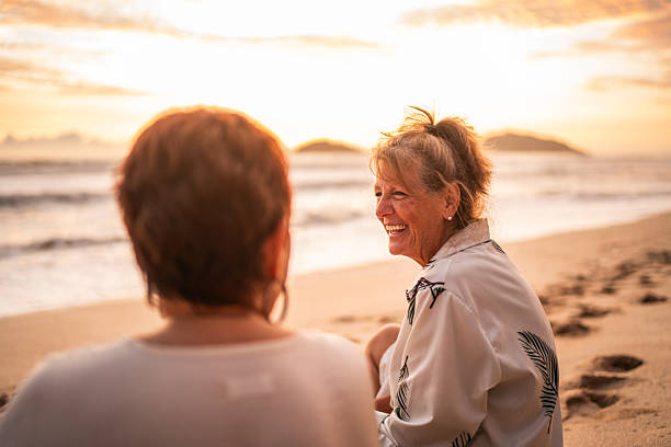 istock Senior friends women talking on the beach 2244050154
