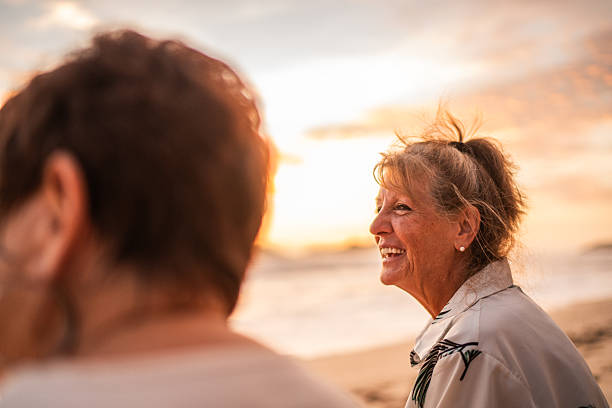 istock Senior friends women talking on the beach 2244050171