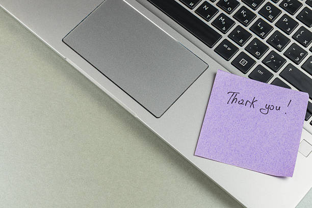 istock Thank you note on laptop offers gratitude in a workspace setting 2244050995