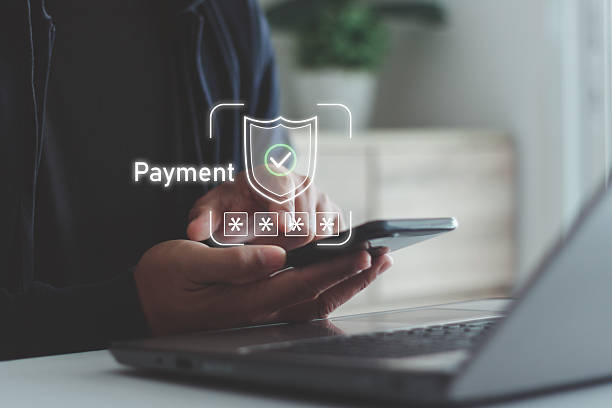 istock Secure online payment concept. Person using mobile phone and laptop, showing data protection, digital transaction and financial technology for safe money transfer and authentication. 2244055273