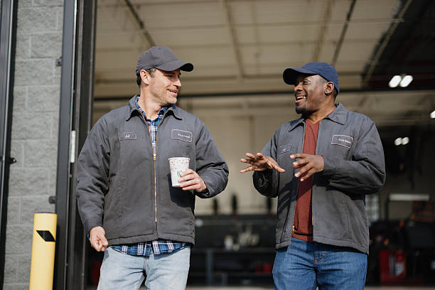 istock Two mechanics enjoying their coffee break, talking and laughing 2244059227