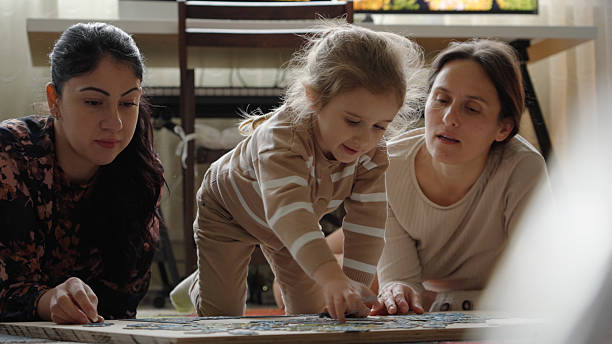 istock Family Leisure Time & Togetherness. Doing A Puzzle Together 2244060932