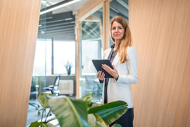 istock Professional Female Financial Advisor with Tablet in Office 2244061407