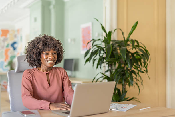 istock Joyful woman celebrating success while working remotely 2244065982