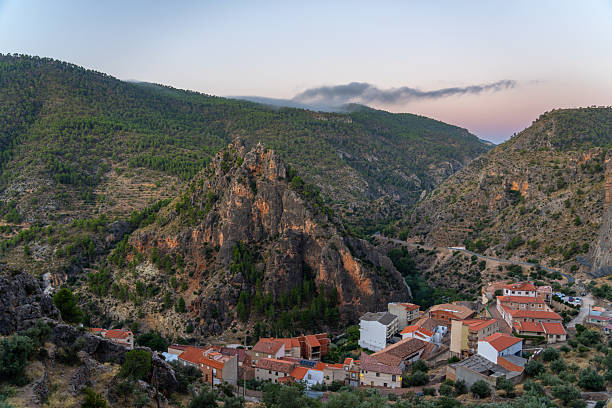 istock Village nestled in a rugged mountain valley at dusk. 2244068717