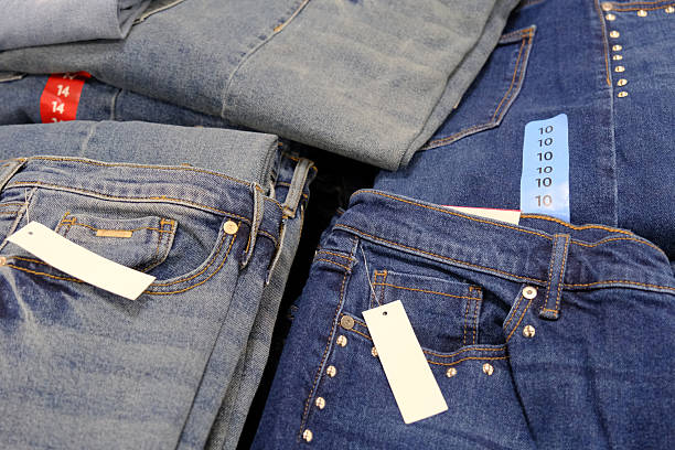 istock Women's blue jeans for sale in a store 2244070023
