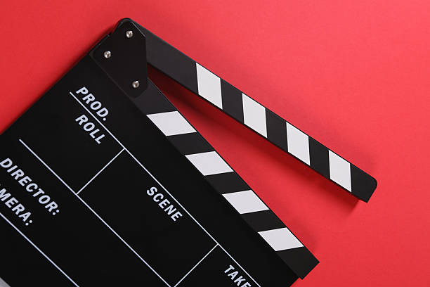 istock Clapperboard on red background, top view. Film industry 2244072758