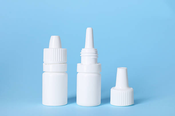 istock Bottles of medical drops on light blue background 2244072815